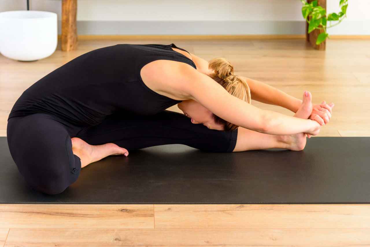 A female performing a yoga pose