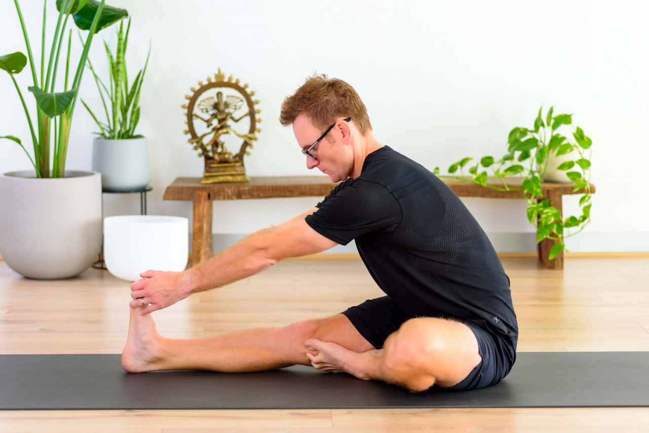A male performing a yoga pose